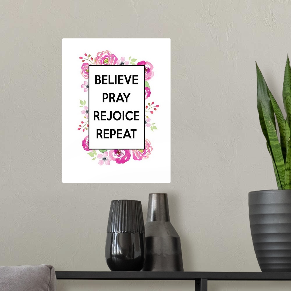 A modern room featuring "Believe, Pray, Rejoice, Repeat"