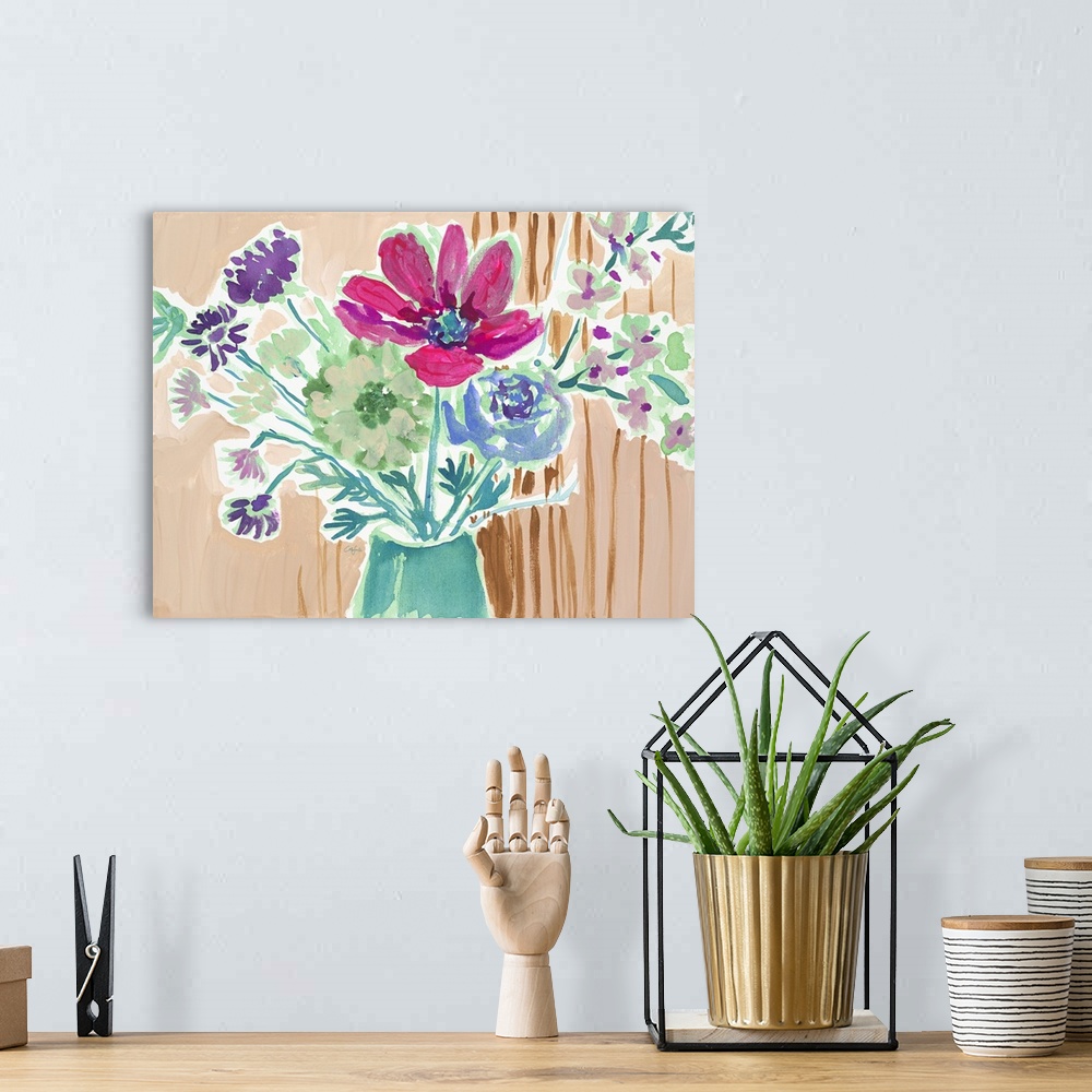 A bohemian room featuring Watercolor painting of a bouquet of pink, green, and blue flowers on tan.