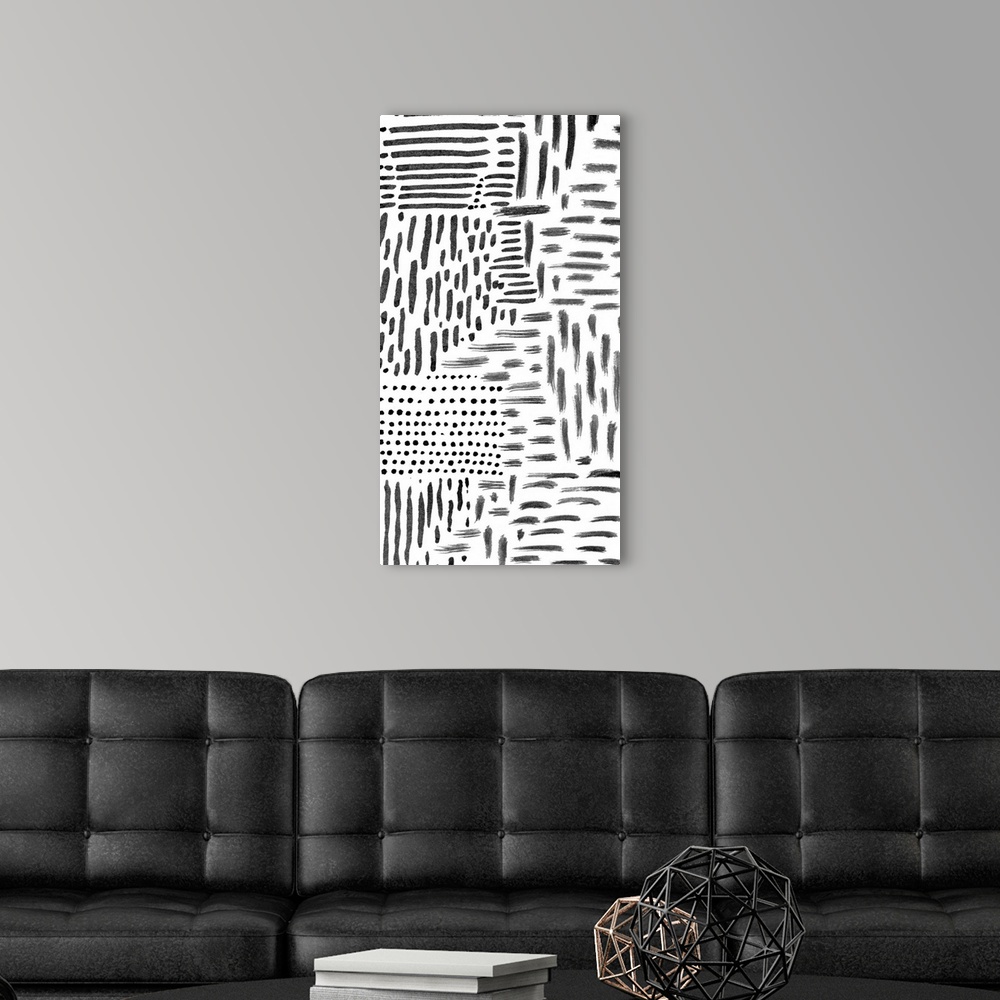 A modern room featuring Abstract painting of black marks and streaks on white.