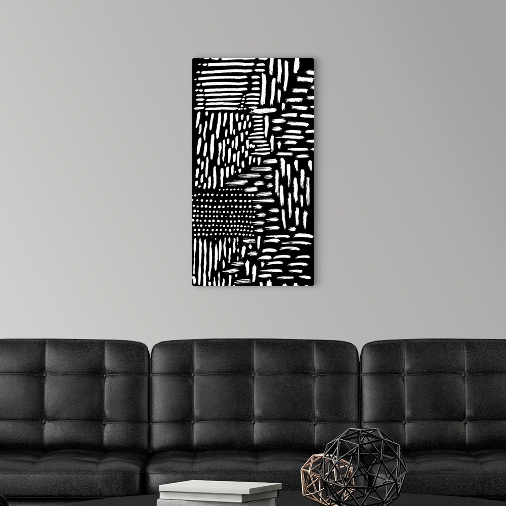 A modern room featuring Abstract painting of several white strokes on black.