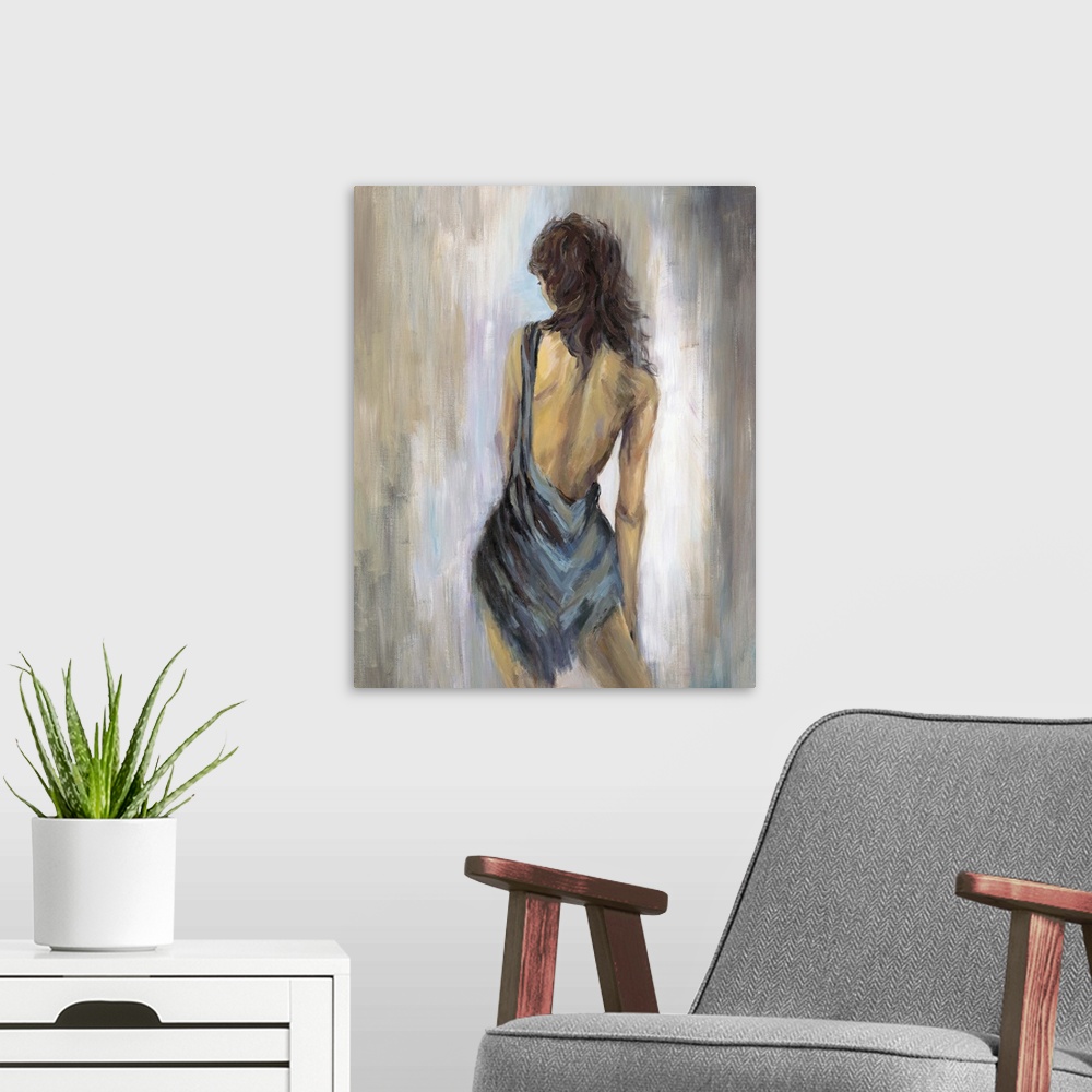 A modern room featuring Home decor artwork of a rear view of a woman wearing a blue backless dress.