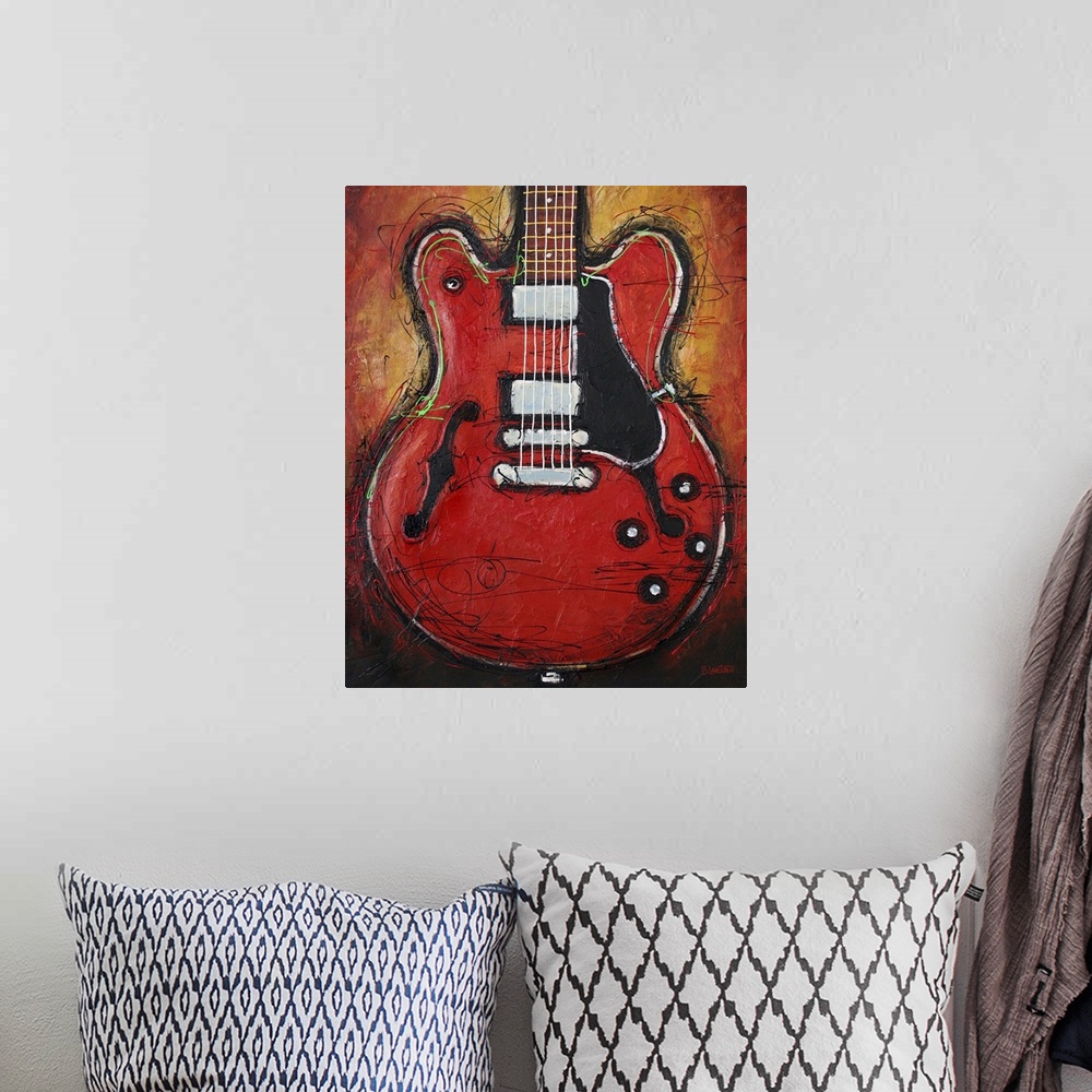 A bohemian room featuring Contemporary painting of a guitar against an orange background.
