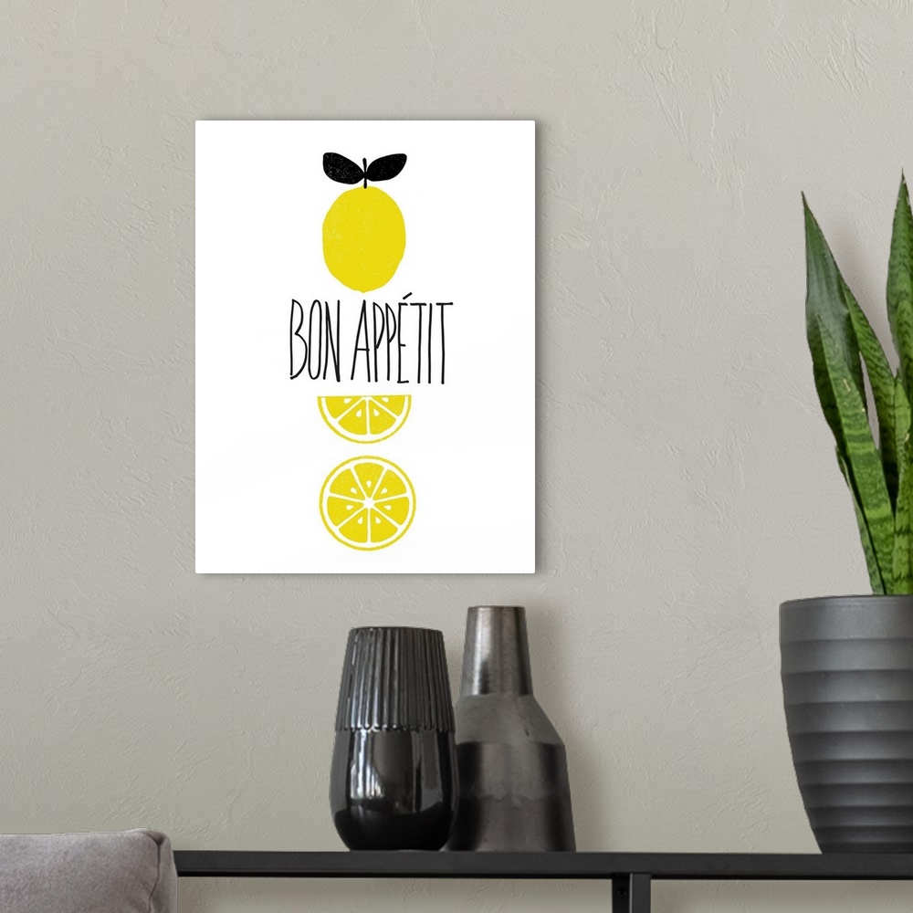 A modern room featuring "Bon Appetit" written in the center of a white background with illustrations of lemons.