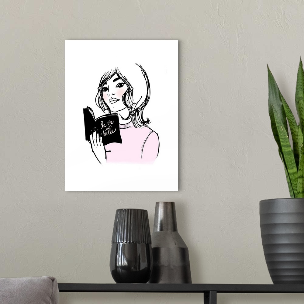 A modern room featuring Illustration of a woman reading a book titled "la vie est belle" in black, white, and pink hues.