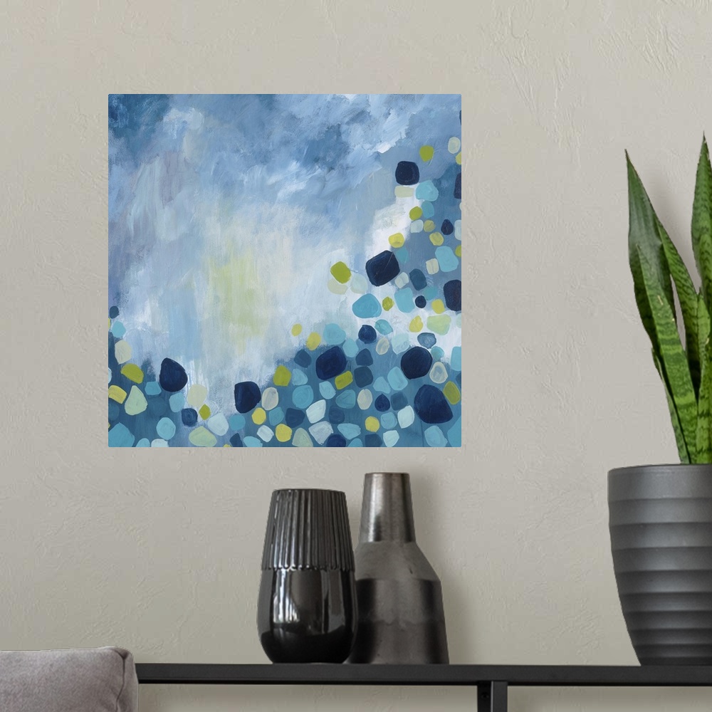 A modern room featuring Contemporary abstract painting using tones of blue with circular shapes in various repeating colo...