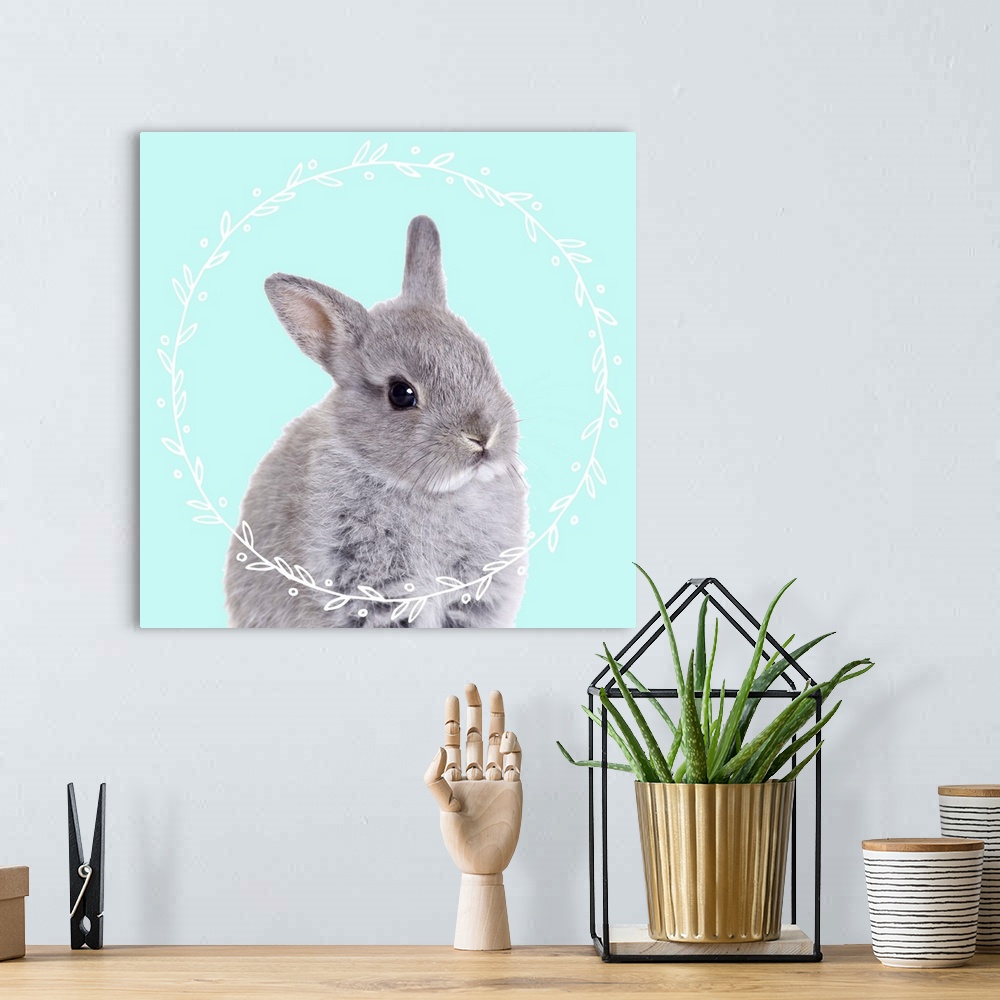 A bohemian room featuring Black and white photograph of a baby bunny on the middle of a light blue background with an illus...
