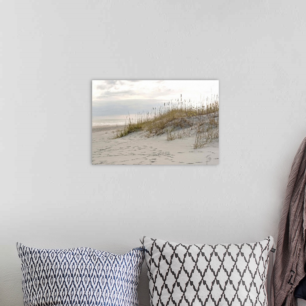 A bohemian room featuring Photograph of a sandy beach at sunset.