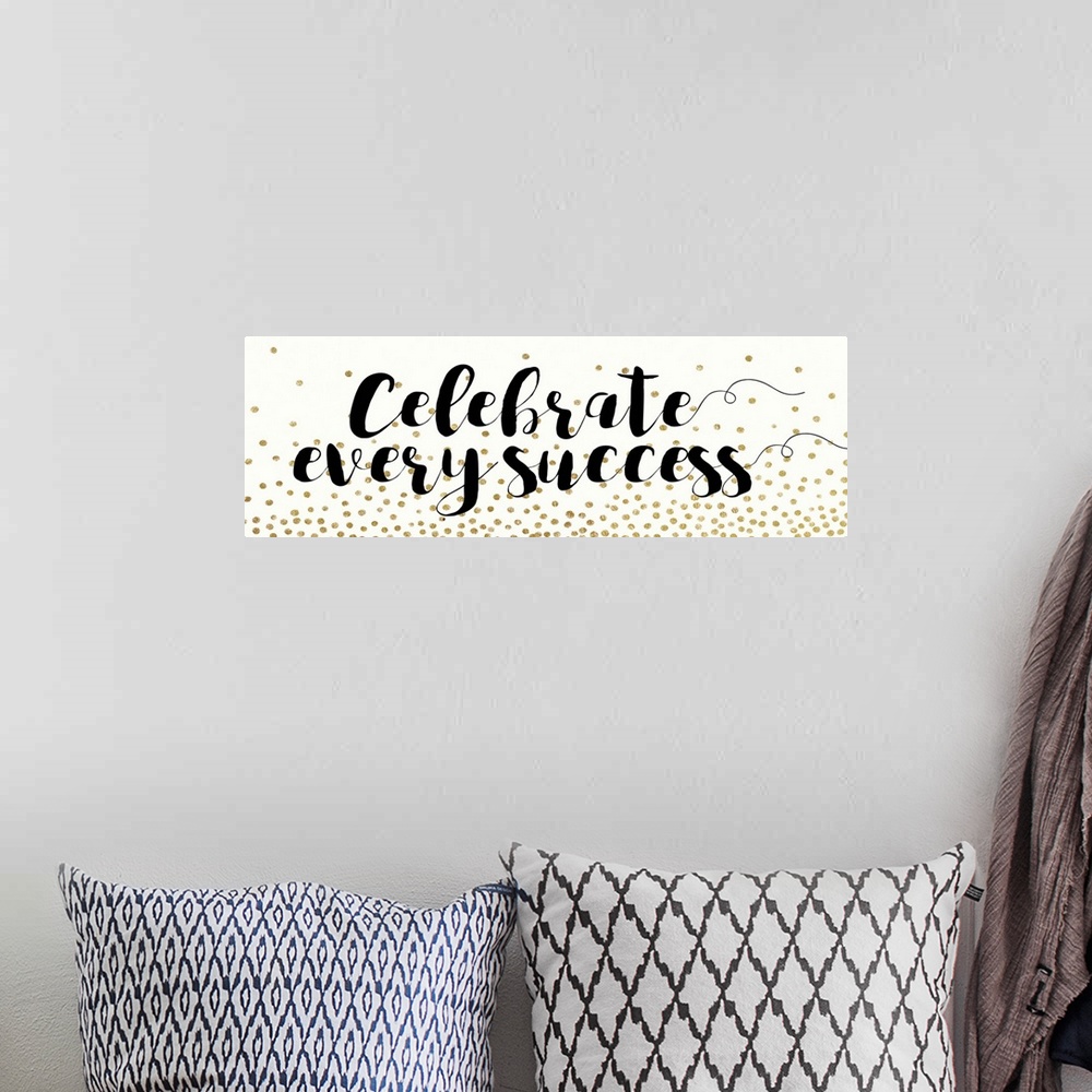 A bohemian room featuring Motivational sentiment in black calligraphy with gold dots.
