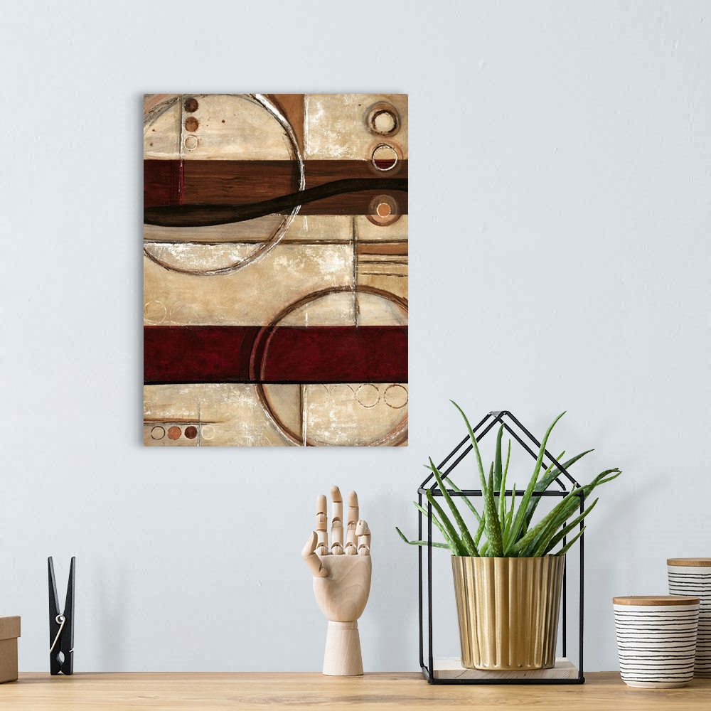 A bohemian room featuring Contemporary abstract home decor art work using warm earthy tones and rigid geometric shapes.