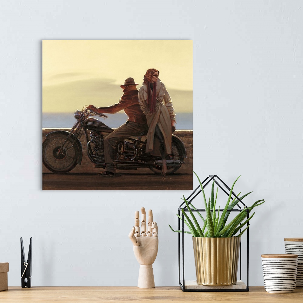 A bohemian room featuring Contemporary painting of man sitting on a motorcycle with a woman standing beside him.