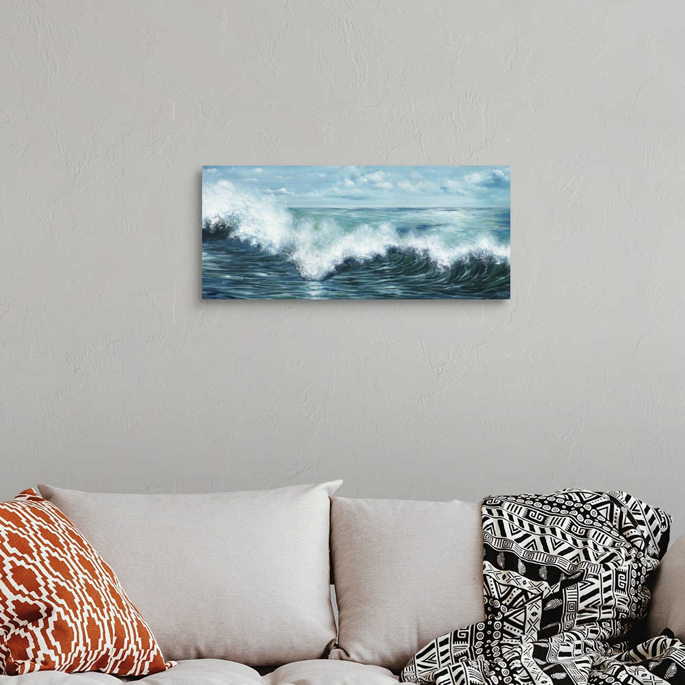 A bohemian room featuring Contemporary artwork of a wave curling and splashing off the ocean.