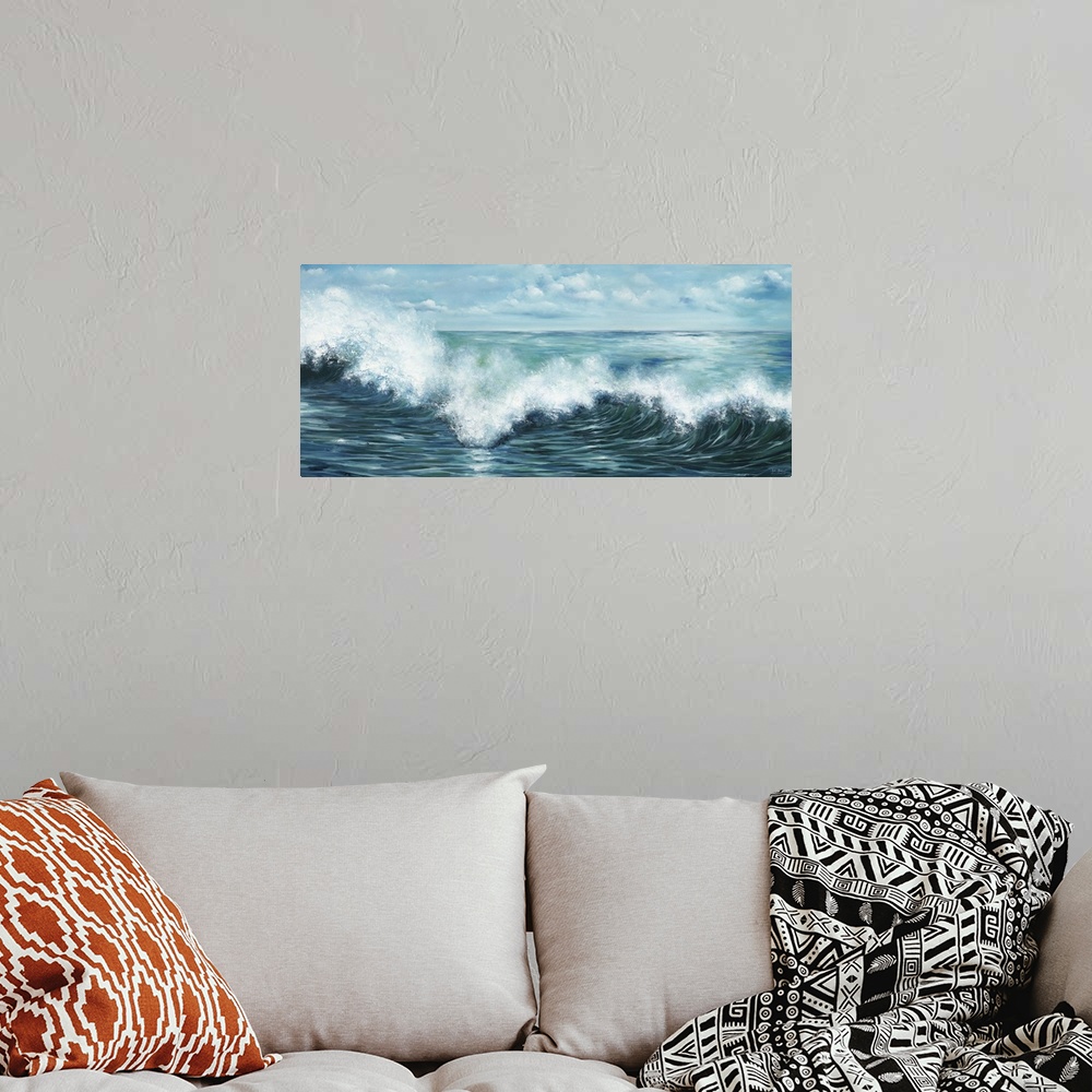 A bohemian room featuring Contemporary artwork of a wave curling and splashing off the ocean.