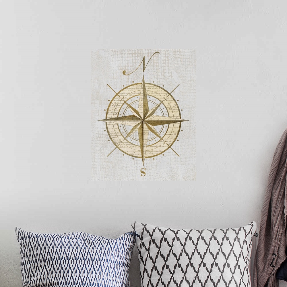 A bohemian room featuring Artwork of an antique compass rose representing north and south.