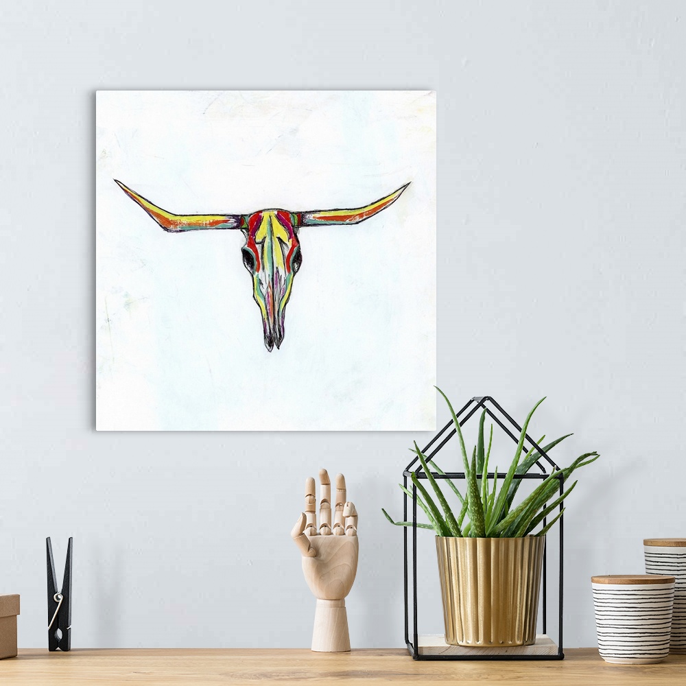 A bohemian room featuring Contemporary painting of a multi-colored cow skull with long horns.