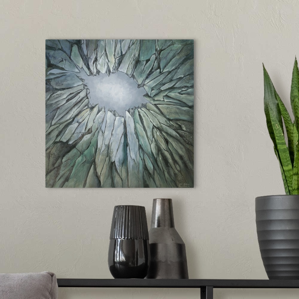 A modern room featuring Contemporary artwork of a muted teal rock formation with jagged edges.