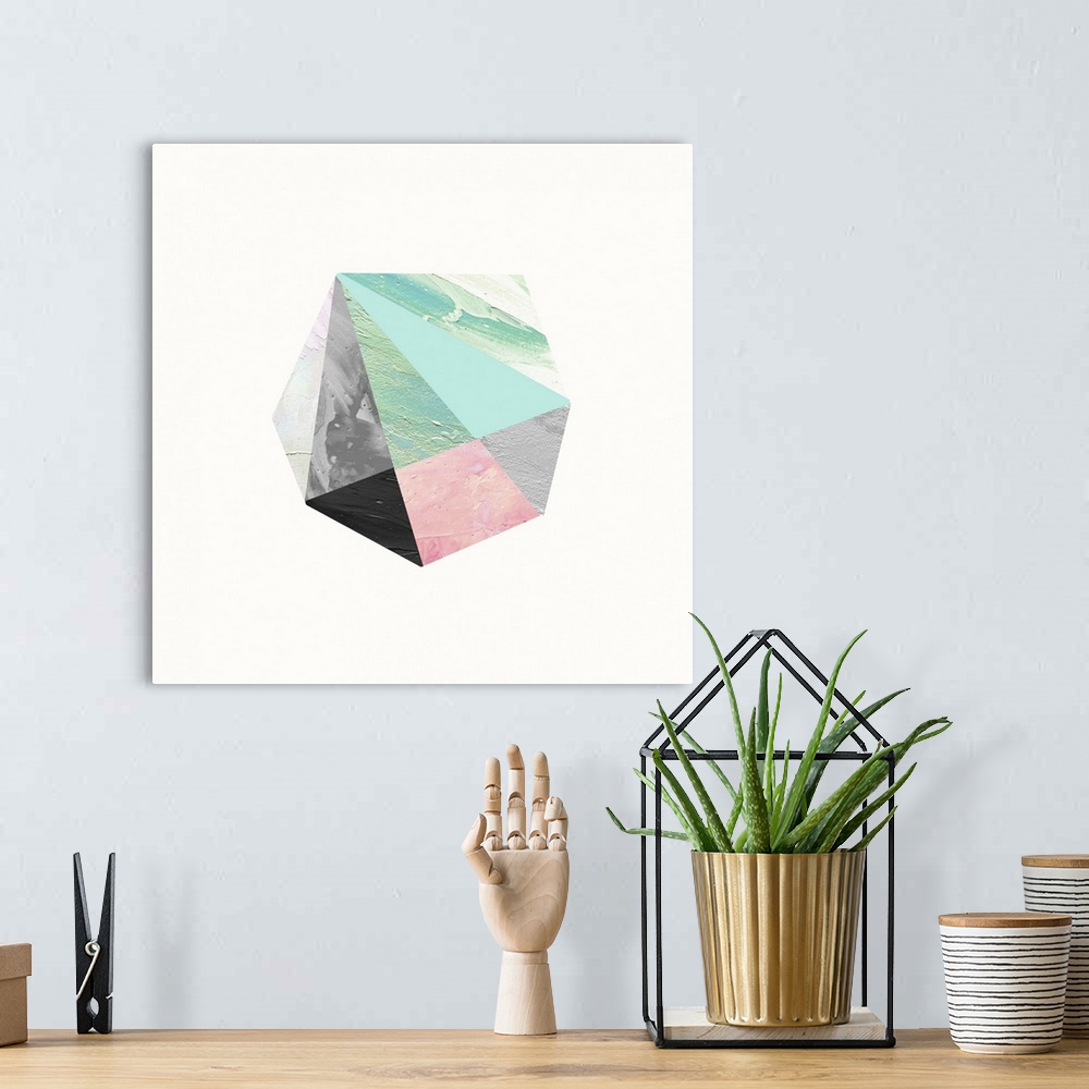A bohemian room featuring Modern art of a faceted crystal shape in black, pink, and light blue on white.