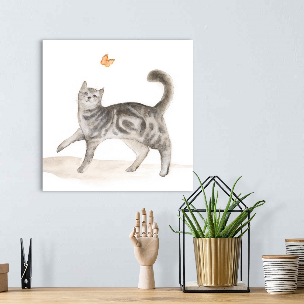 A bohemian room featuring Sweet watercolor painting of a grey tabby cat chasing a butterfly.