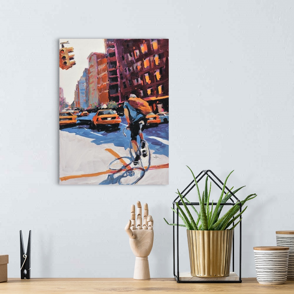 A bohemian room featuring Contemporary painting of a person riding a bicycle through the city.