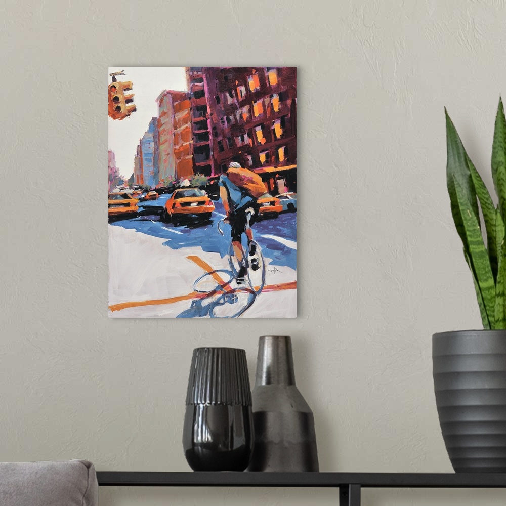 A modern room featuring Contemporary painting of a person riding a bicycle through the city.