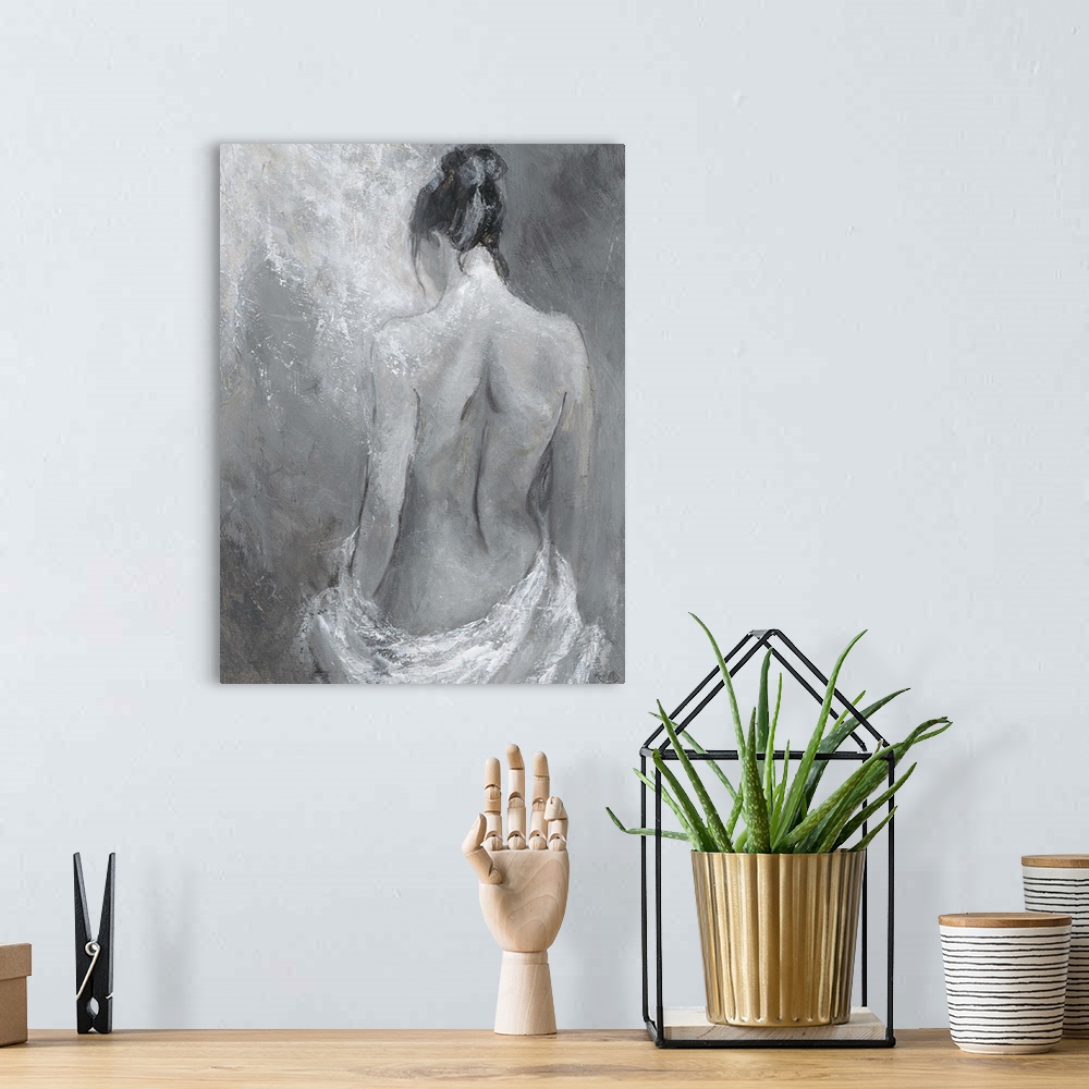 A bohemian room featuring Monochrome artwork of a nude female figure.