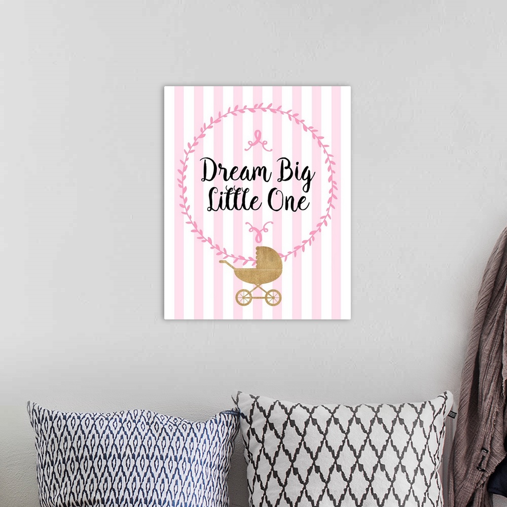 A bohemian room featuring Pink nursery art with black handlettered text and a gold stroller.