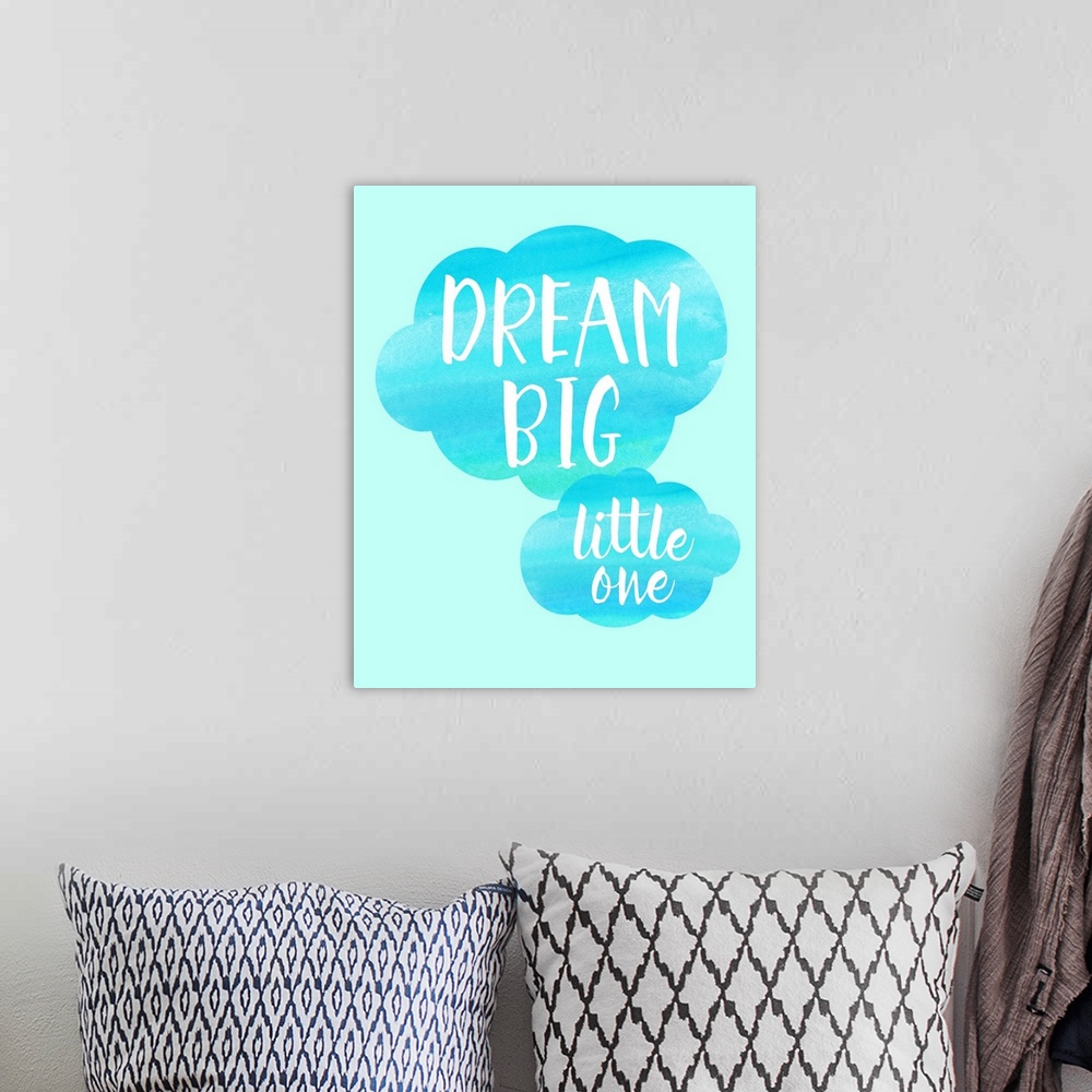 A bohemian room featuring Blue nursery art with white text on puffy clouds.