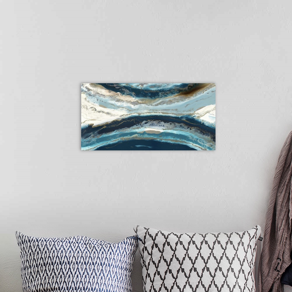 A bohemian room featuring Abstract painting in deep blue and light beige resembling an aerial view of the ocean and shore.