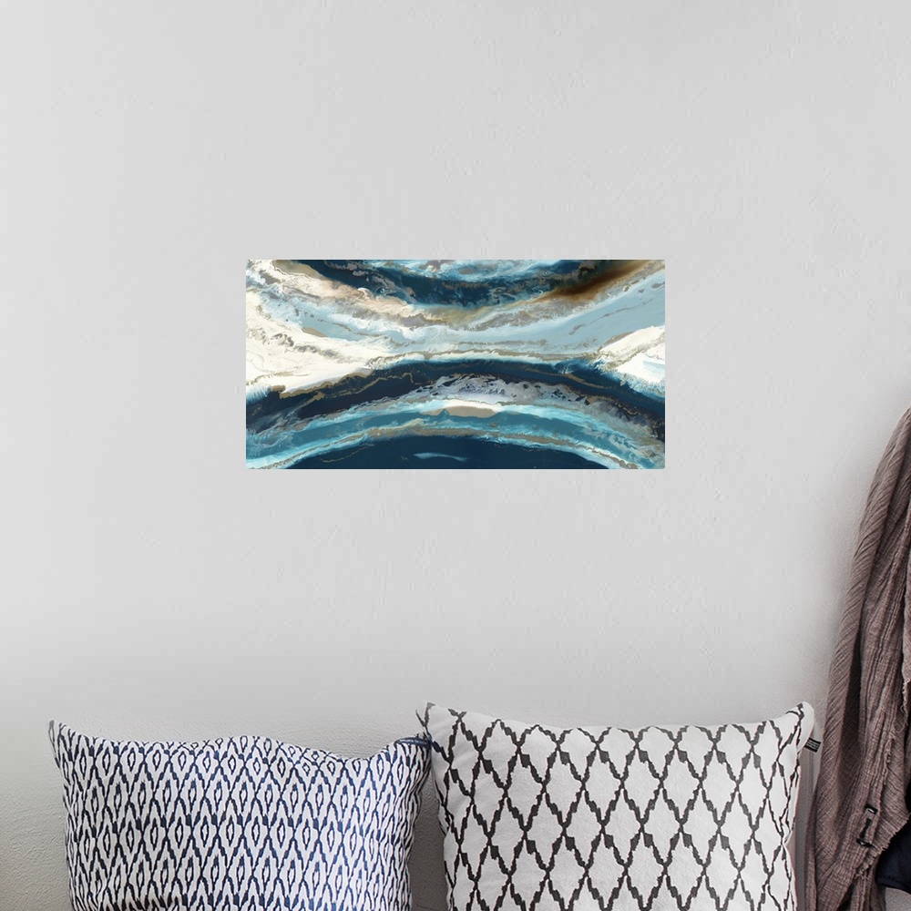 A bohemian room featuring Abstract painting in deep blue and light beige resembling an aerial view of the ocean and shore.