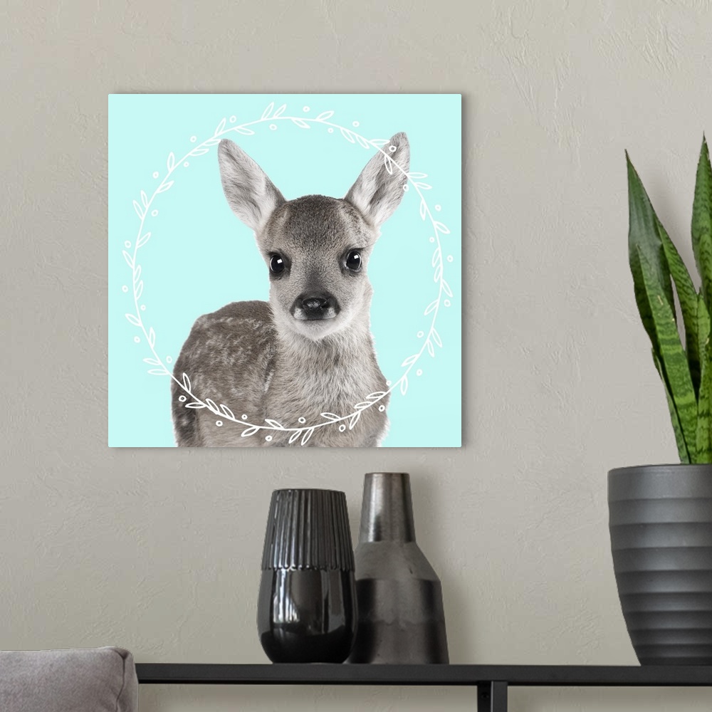 A modern room featuring Black and white photograph of a fawn on the middle of a light blue background with an illustrated...