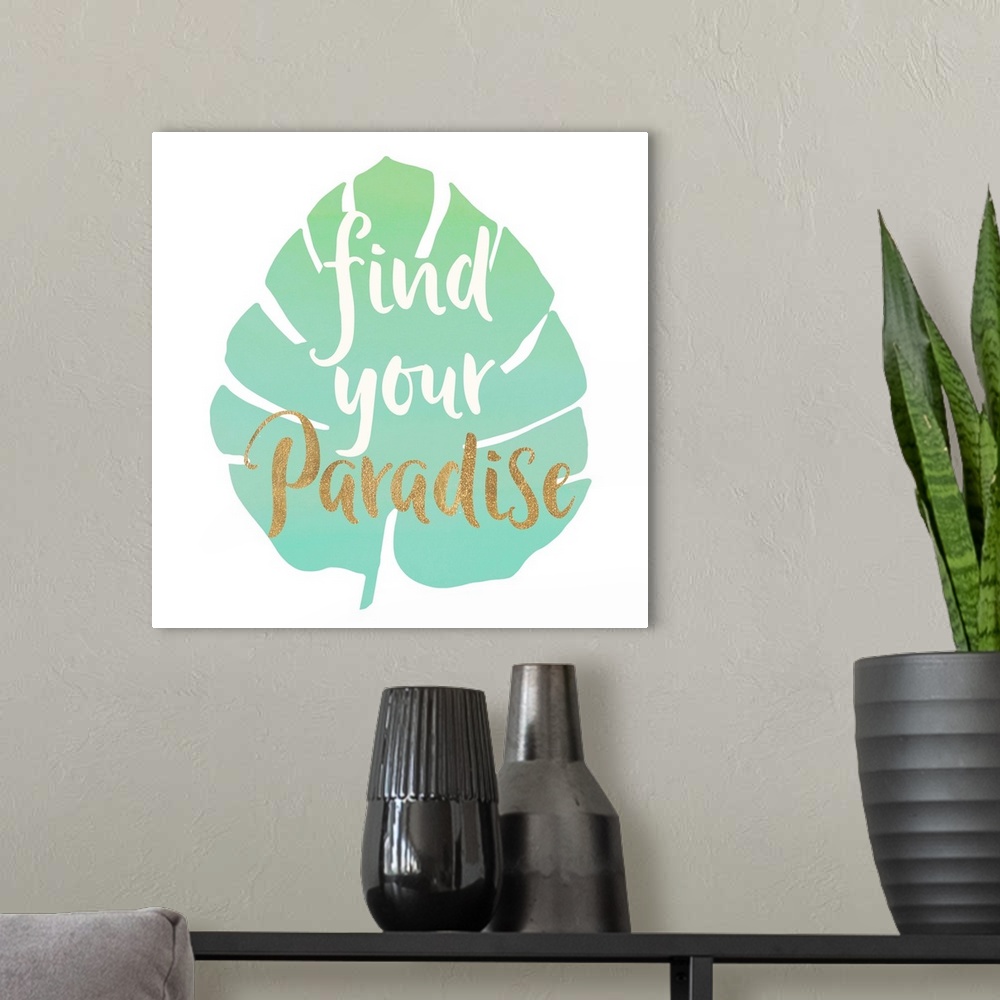 A modern room featuring White and gold handlettered text over a green tropical leaf.