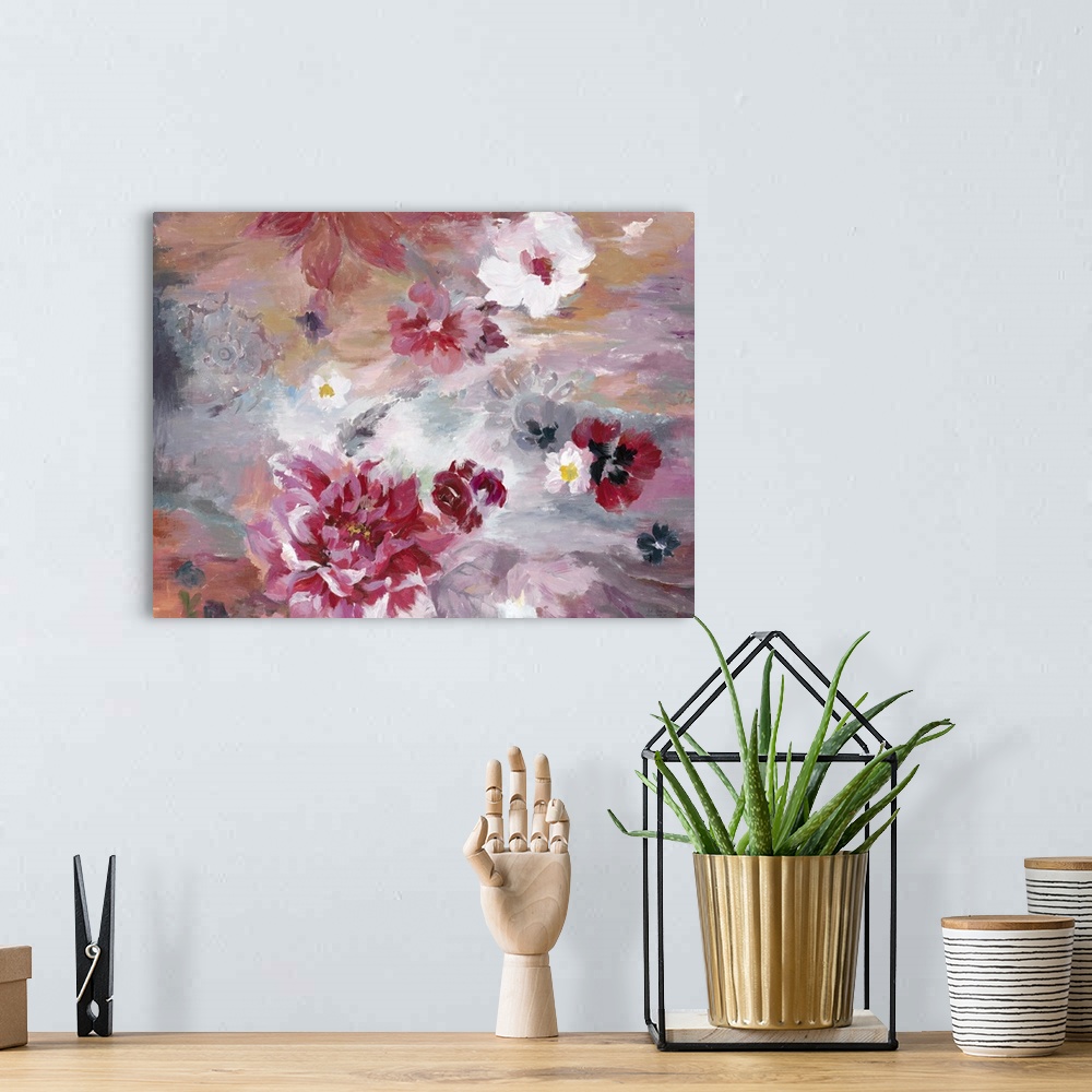 A bohemian room featuring Contemporary artwork of vibrant red and soft pink flowers against a red and pale blue background.