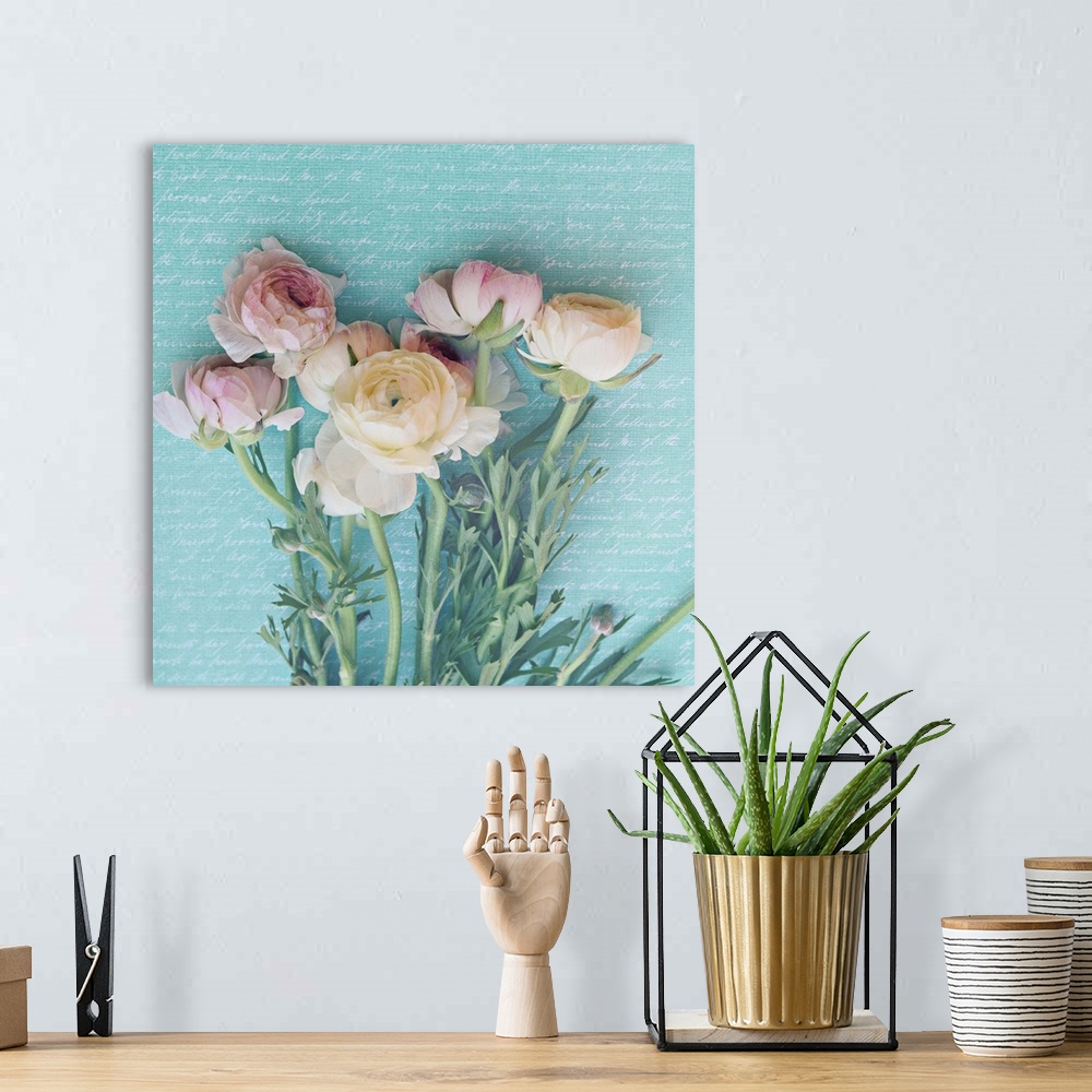 A bohemian room featuring Square photograph of pink and white peonies with long, leafy stems laying on a light blue backgro...
