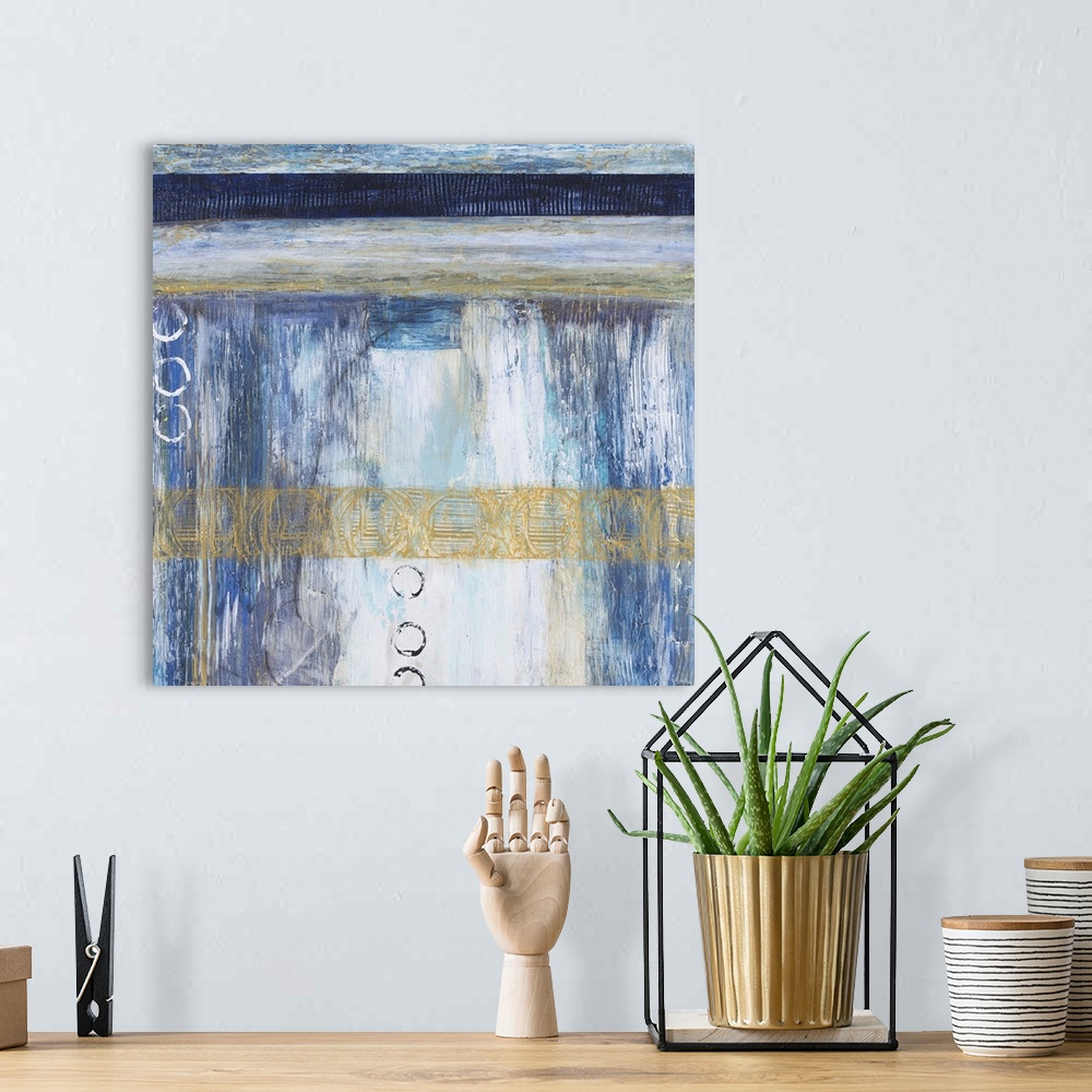 A bohemian room featuring Contemporary abstract painting using blue and neutral tones with hints of gold.