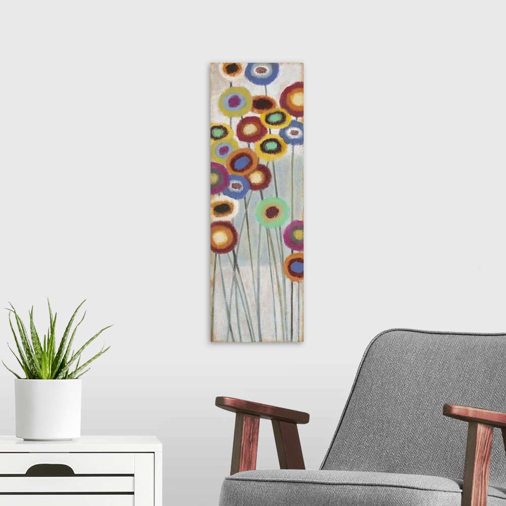 A modern room featuring Contemporary abstract painting of colorful flowers on long stems.