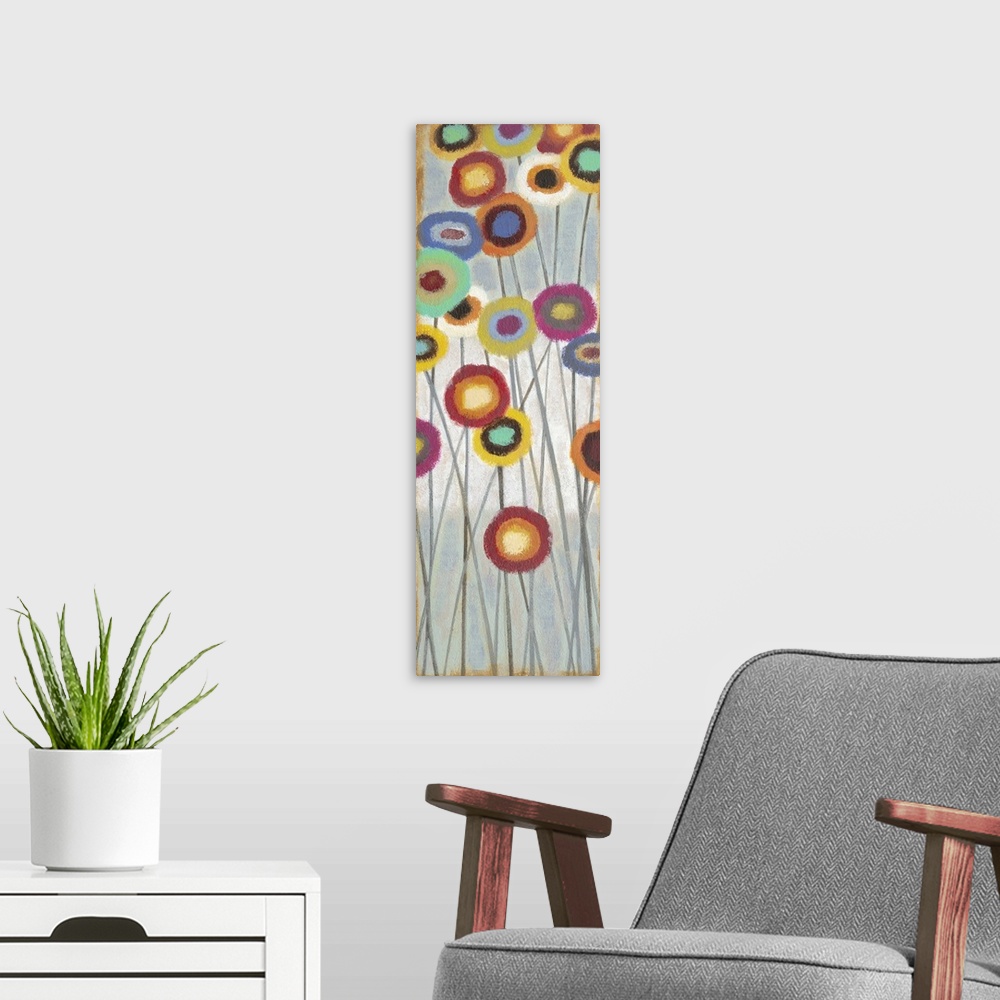 A modern room featuring Contemporary abstract painting of colorful flowers on long stems.