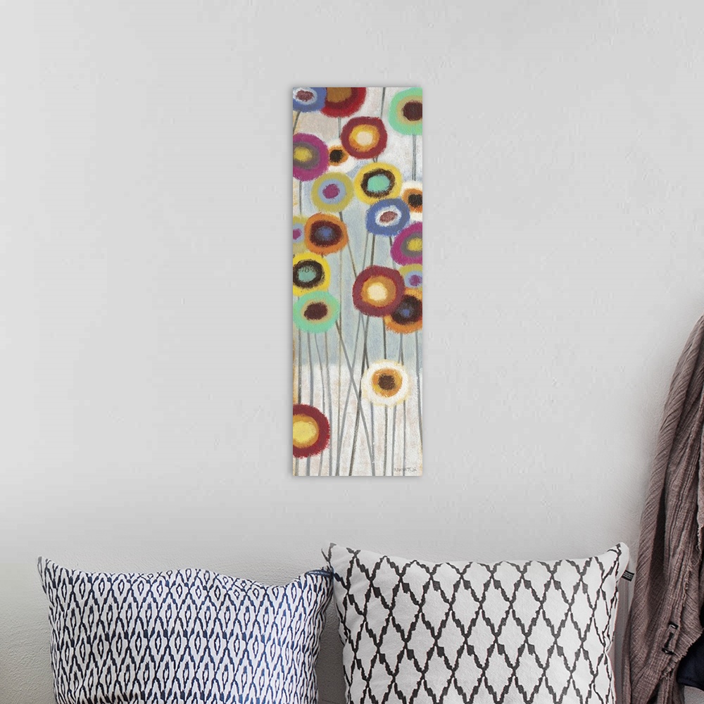 A bohemian room featuring Contemporary abstract painting of colorful flowers on long stems.