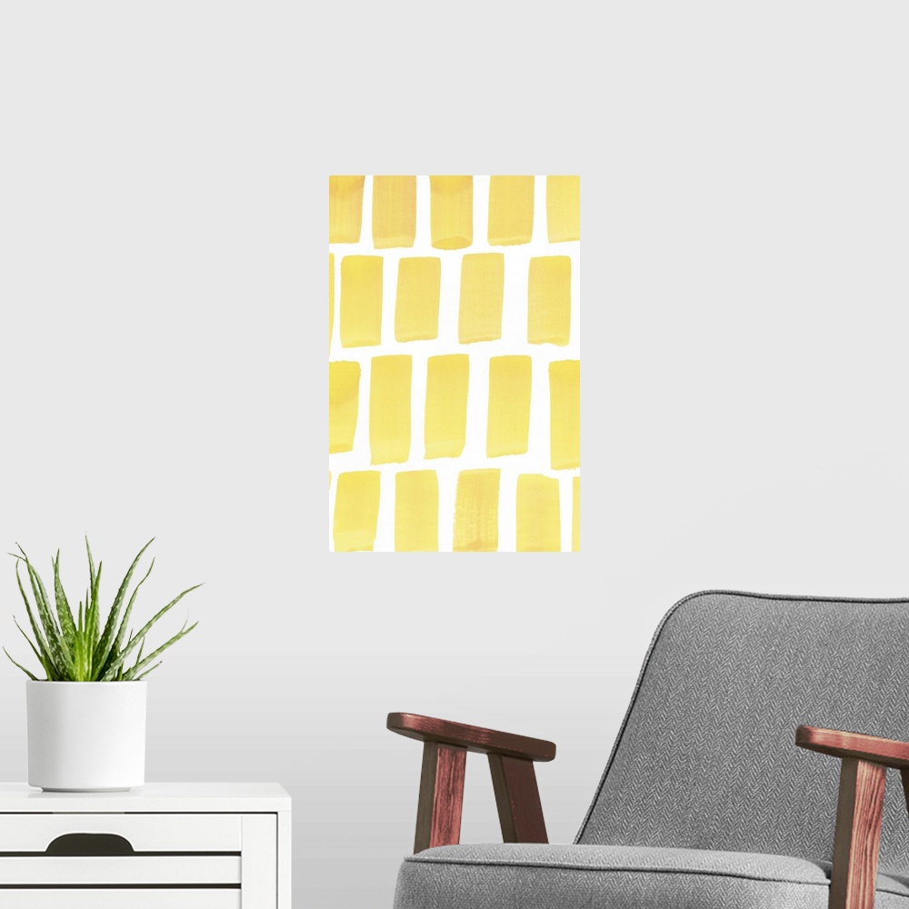 A modern room featuring Contemporary abstract painting vertical wide strokes of yellow against a white background.
