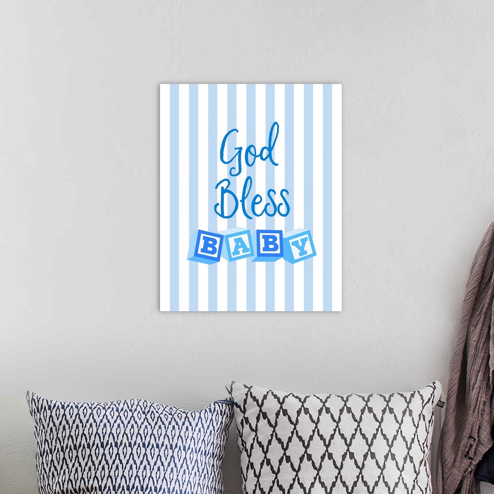 A bohemian room featuring Blue nursery art reading "God bless baby" with letter blocks on stripes.