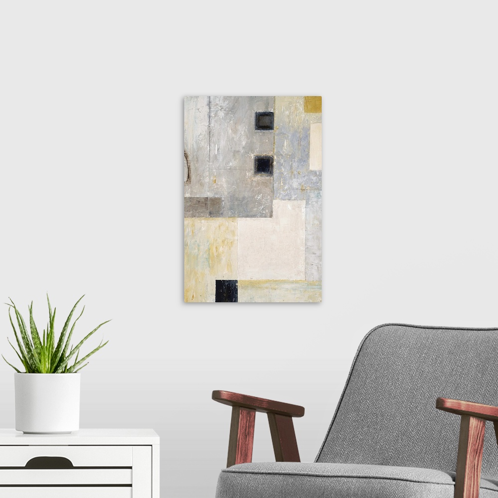 A modern room featuring Abstract geometric artwork in grey tones with black squares.
