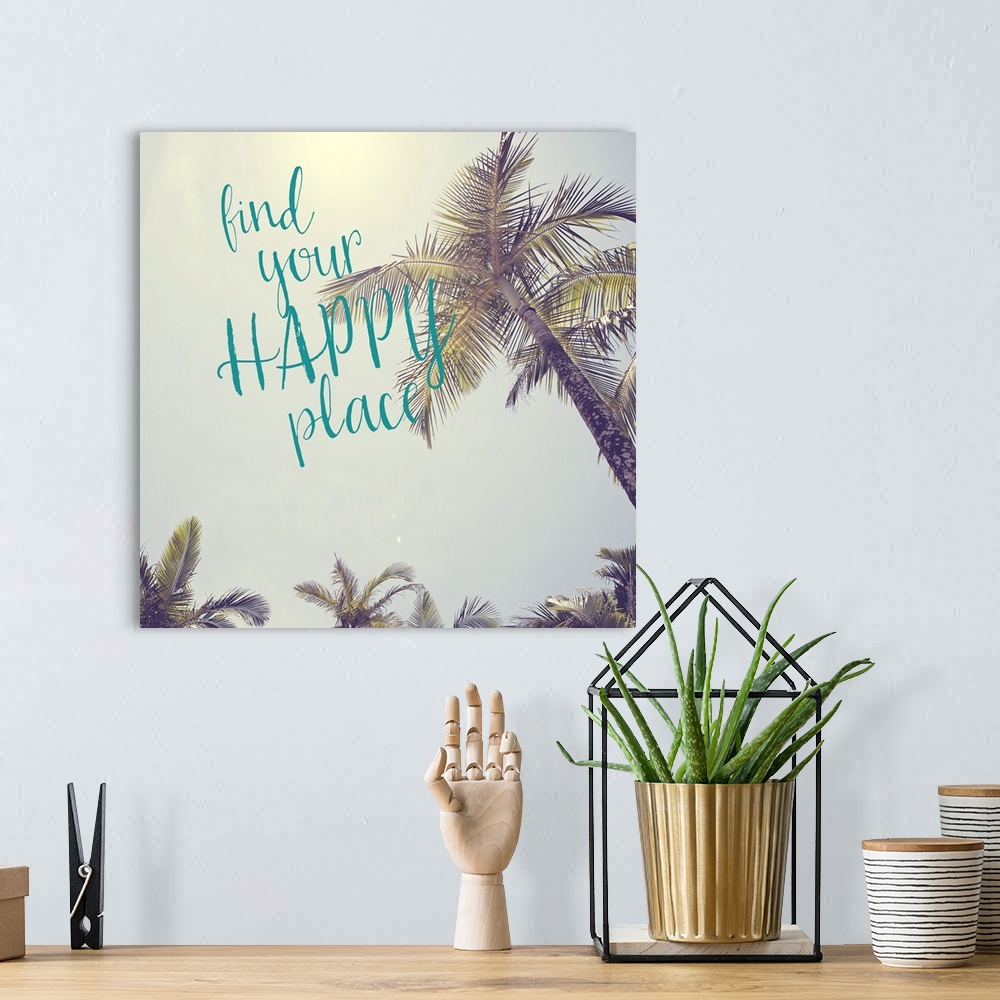 A bohemian room featuring The words "Find your happy place" in teal script over a vintage-style photograph of palm tree lea...