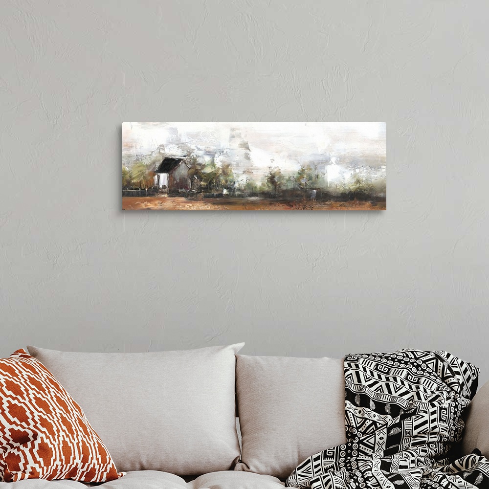 A bohemian room featuring Contemporary artwork lone house standing a countryside field.