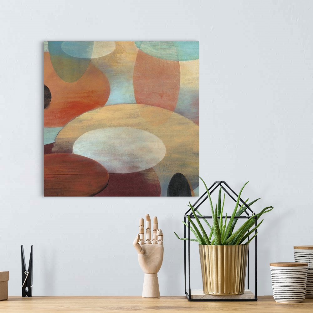 A bohemian room featuring Contemporary abstract painting of organic shapes in pale colors hovering around each other over a...