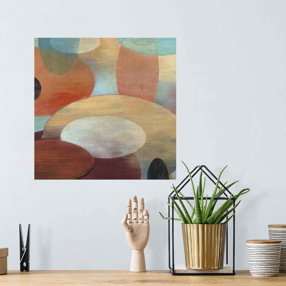 A bohemian room featuring Contemporary abstract painting of organic shapes in pale colors hovering around each other over a...