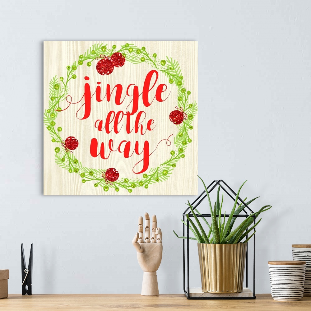 A bohemian room featuring "Jingle All The Way" written in red inside of a Christmas wreath on a faux wood background.