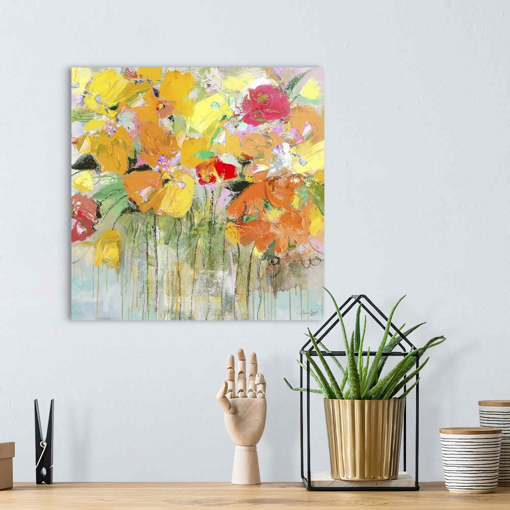 A bohemian room featuring Contemporary artwork of several orange, yellow, and red flowers in a garden.