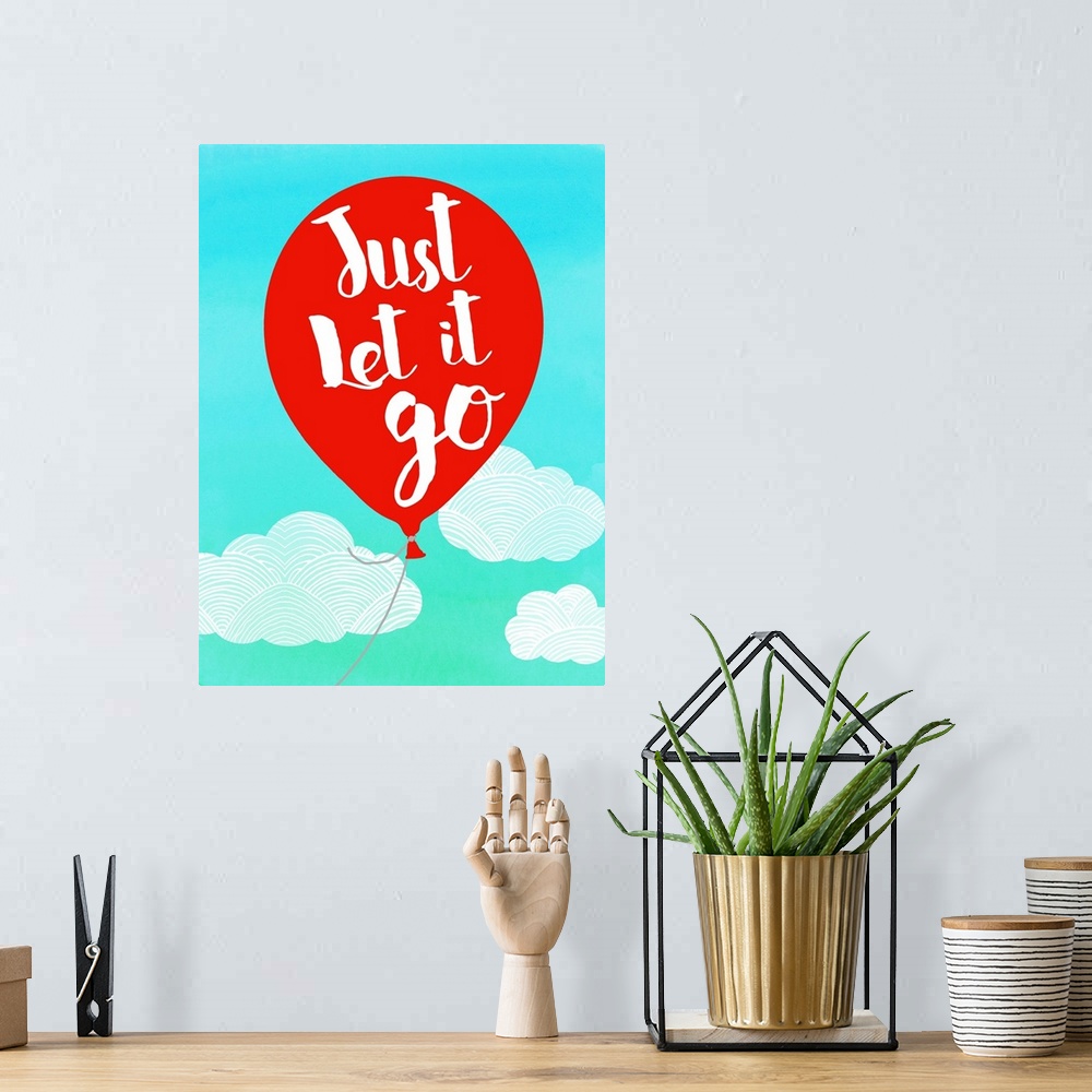 A bohemian room featuring Illustration of a red balloon with "Just Let It Go" written on it, floating with the clouds.