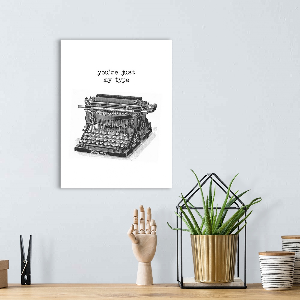 A bohemian room featuring "You're Just My Type" typed above an illustration of a vintage typewriter in black and white.