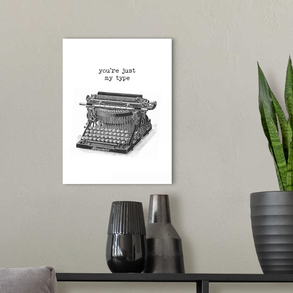 A modern room featuring "You're Just My Type" typed above an illustration of a vintage typewriter in black and white.