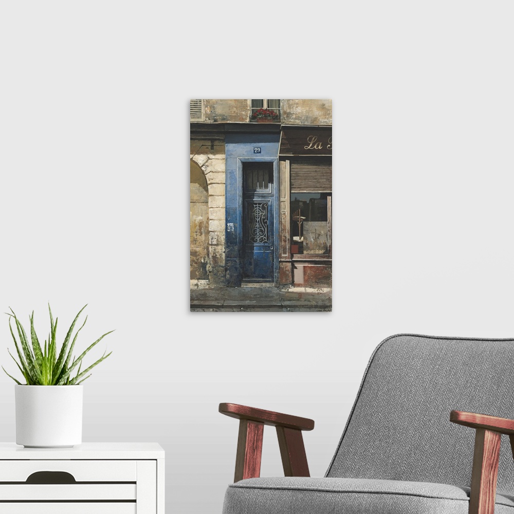 A modern room featuring Contemporary painting of a storefront and blue door downtown in a city.