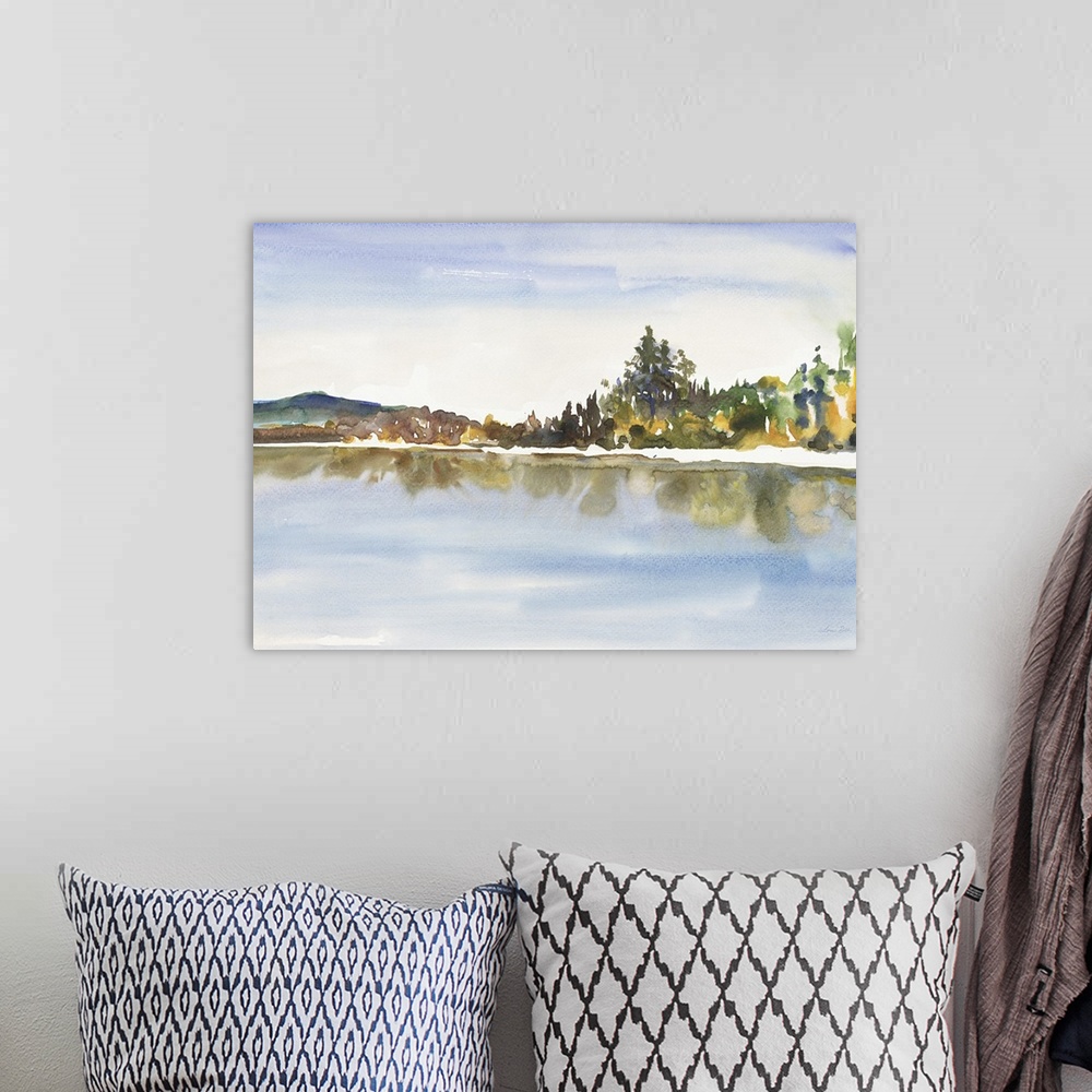A bohemian room featuring Watercolor landscape painting of a lake with trees along the edge.